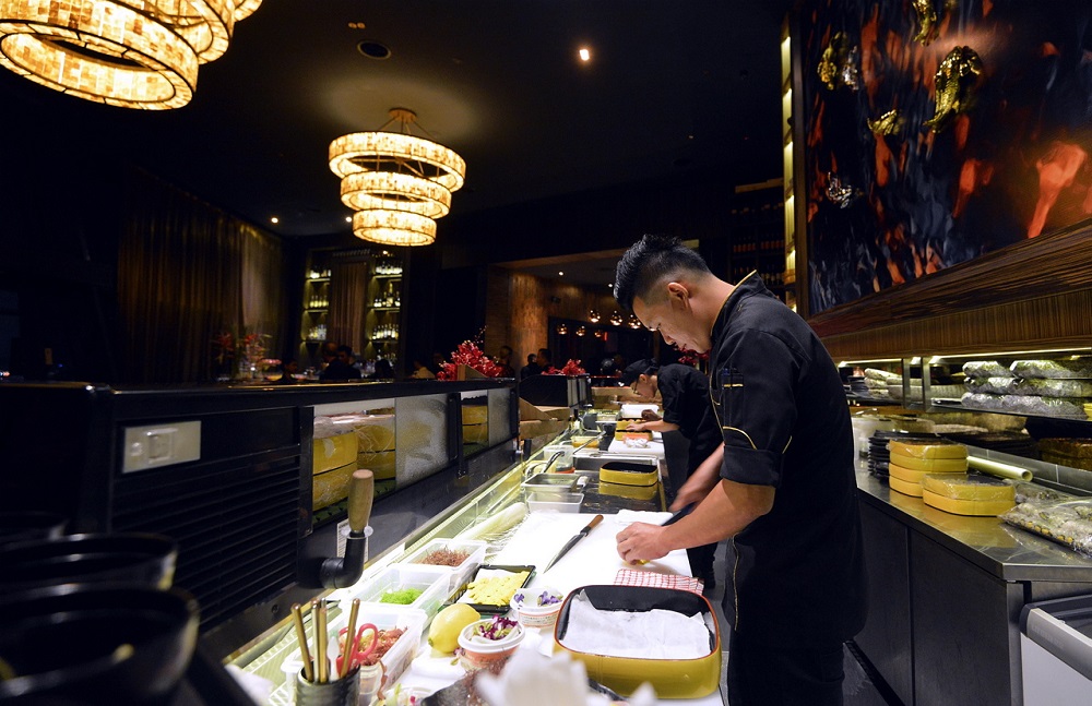 Chefs hard at work behind CE LA VI’s sushi counter.