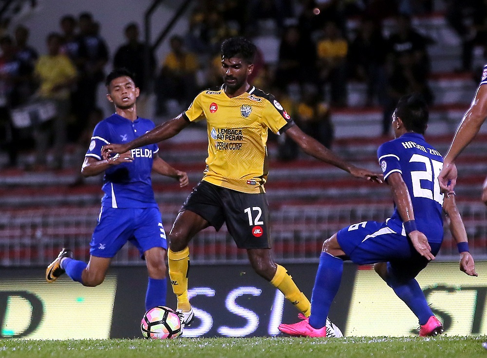 Perak midfielder Kenny Pallraj (centre) in action during a match. u00e2u20acu201d Picture by  Farhan Najib