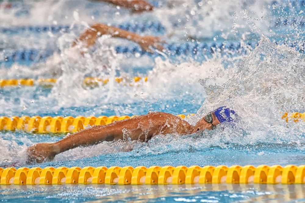 A swimmer swims his way to the finish line during the 19th Malaysian Games in Perak. — Picture by Marcus Pheong