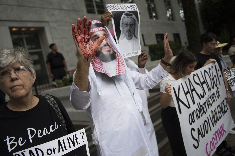 A demonstrator dressed as Saudi Arabian Crown Prince Mohammed Salman with blood on his hands protests with others outside the Saudi Embassy in Washington, DC, on October 8, 2018. u00e2u20acu201d AFP pic