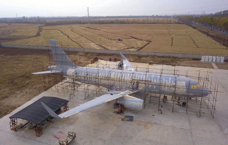 This aerial photo taken on October 25, 2018 shows people working on a full-size replica of an Airbus A320 passenger aircraft in Kaiyuan, China's northeastern Liaoning province. u00e2u20acu2022 AFP pic