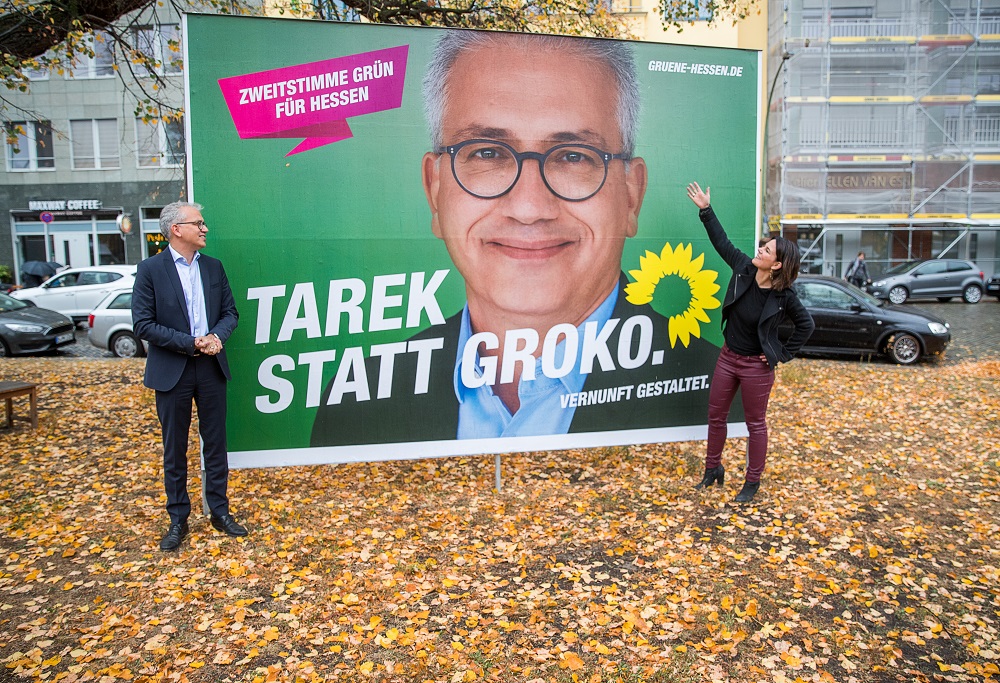 Annalena Baerbock, federal chairman of Alliance 90  The Greens, and Tarek Al-Wazir, candidate of the Greens for the state elections in Hesse, pose in fornt of an election poster in Berlin on October 22, 2018. u00e2u20acu201d AFP pic