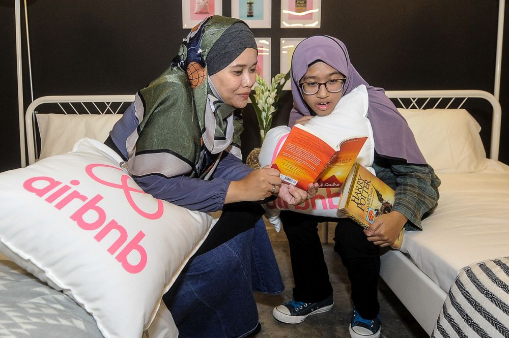 Roshilawati and her daughter Shireen enjoyed their sleepover at the bookstore. u00e2u20acu201d Picture by Shafwan Zaidon