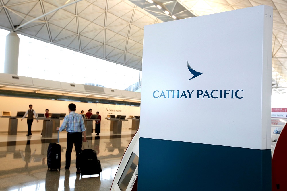 A passenger walks to the First Class counter of Cathay Pacific Airways at Hong Kong Airport in Hong Kong, China April 4, 2018. u00e2u20acu201d Reuters pic