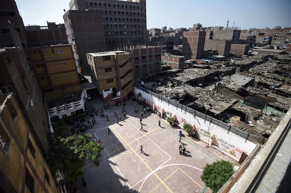 A picture taken on October 13, 2018, shows the Mahaba school in Ezbet al-Nakhl with a wall separating it from the shanty town in which it was built, north of the Egyptian capital Cairo. u00e2u20acu201d AFP pic  