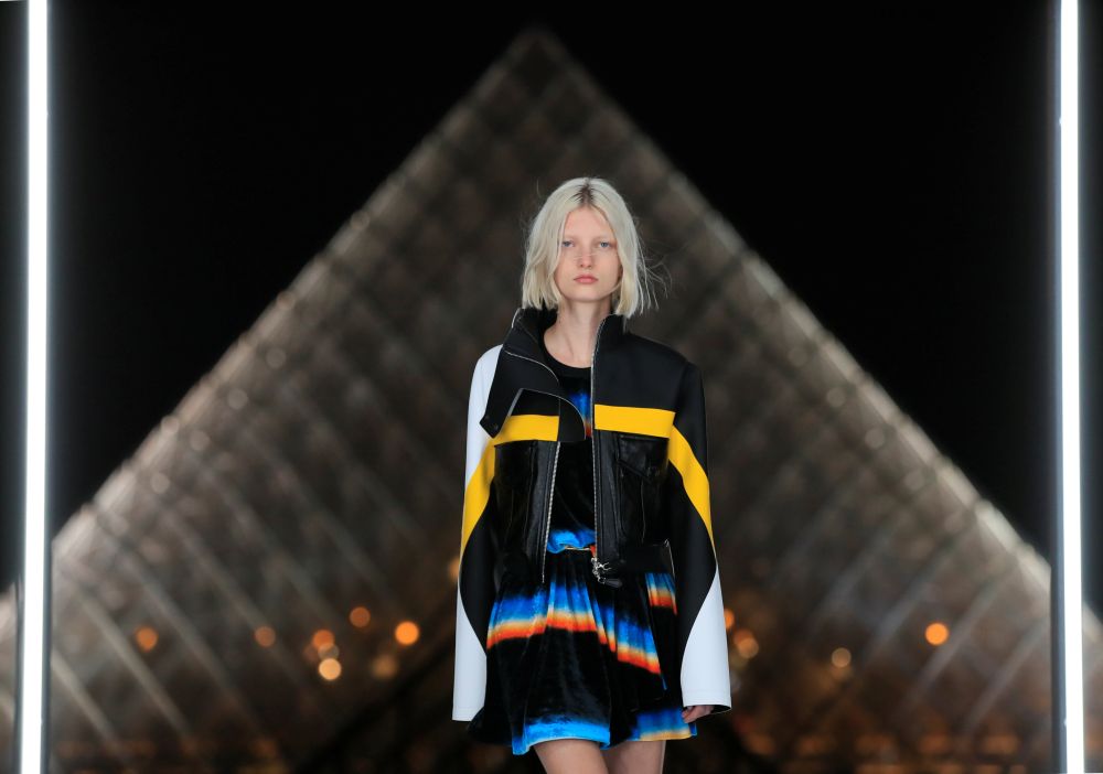 A model presents a creation by French designer Nicolas Ghesquiere as part of his Spring/Summer 2019 women's ready-to-wear collection show for Louis Vuitton next to the Louvre Pyramid during the Paris Fashion Week in Paris October 2, 2018. u00e2u20acu2022 Reuters pic