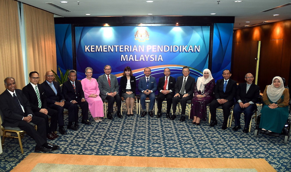Education Minister Maszlee Malik and deputy Teo Nie Ching pose for pictures with the National Education Advisory Council (MPPK) in Putrajaya October 2, 2018. u00e2u20acu201d Bernama pic