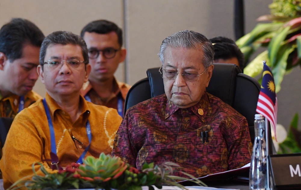 Tun Dr Mahathir Mohamad and Datuk Saifuddin Abdullah attend the Asean Leaders Gathering in Bali October 11, 2018. u00e2u20acu201d Bernama pic