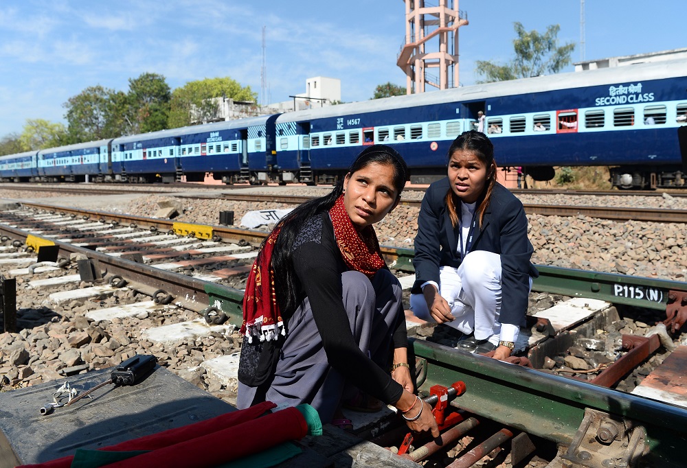 This photo taken on March 6, 2018, shows Neelam Jatav (right) with a colleague working on a railway track at the Gandhinagar railway station in Jaipur. u00e2u20acu201d AFP pic