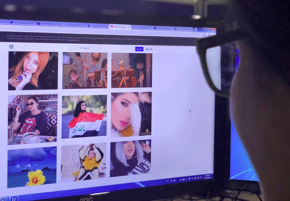 A person looks at the profile page of Iraqi model and Instagram starlet Tara Fares in Baghdad September 28, 2018. u00e2u20acu201d AFP pic 