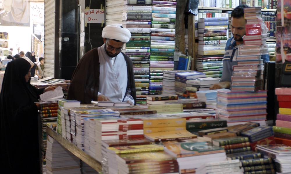 Iraqis check books at the Howeish book market in the holy city of Najaf, 150 kilometres south of Baghdad, on August 16, 2018. u00e2u20acu201d AFP pic  