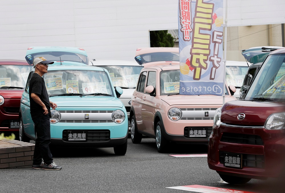 Horie Miho takes a look at minicars at a dealership in Yamato, Kanagawa Prefecture, Japan August 11, 2018. u00e2u20acu201d Reuters pic 