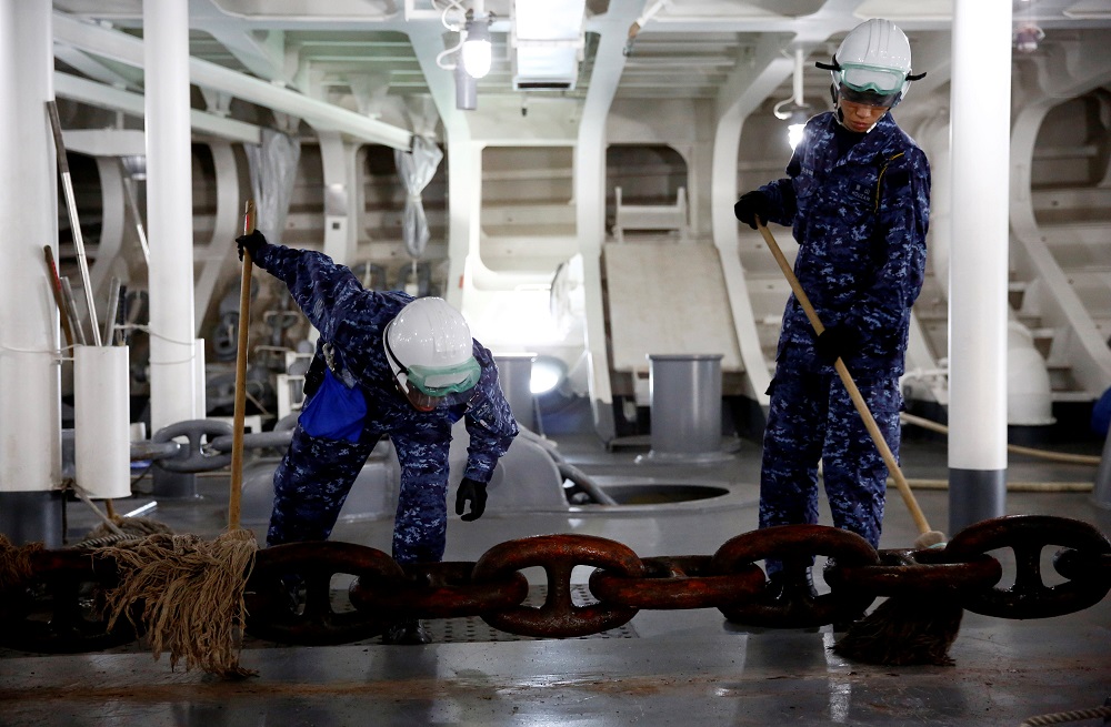 Sailors clean the anchor chain as it is raised on Japanese helicopter carrier Kaga before its departure for naval drills in the Indian Ocean, Indonesia September 22, 2018. u00e2u20acu201d Reuters pic