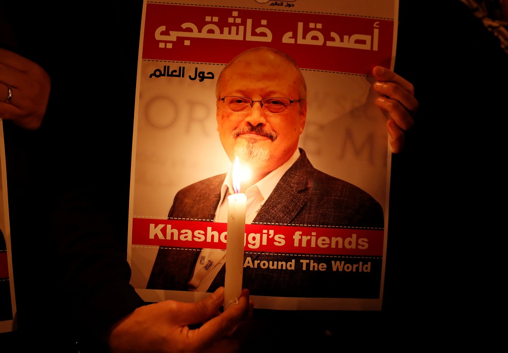 A demonstrator holds a poster with a picture of Saudi journalist Jamal Khashoggi outside the Saudi Arabia consulate in Istanbul, Turkey October 25, 2018. u00e2u20acu201d Reuters pic