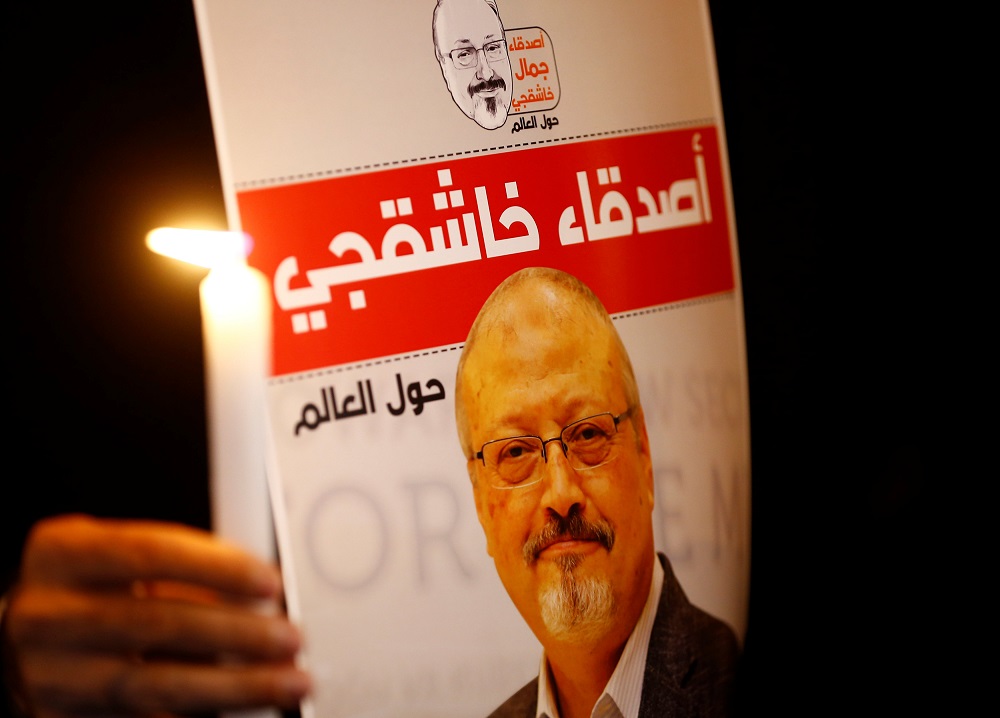 A demonstrator holds a poster with a picture of Saudi journalist Jamal Khashoggi outside the Saudi Arabia consulate in Istanbul, Turkey October 25, 2018. u00e2u20acu201d Reuters pic