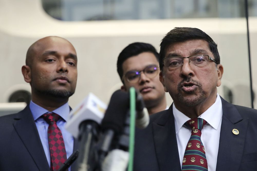 Datin Seri Rosmah Mansor's lawyer K. Kumaraendran (right) speaks to reporters at the entrance of the MACCu00e2u20acu2122s headquarters in Putrajaya October 3, 2018. u00e2u20acu201d Picture by Yusof Mat Isa