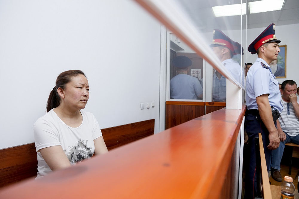 In this file photo taken on July 13, 2018, Sayragul Sauytbay, an ethnic Kazakh Chinese national, who is accused of illegally crossing the border between the, sits inside a defendants' cage during a hearing at a court in Zharkent. u00e2u20acu201d AFP pic 
