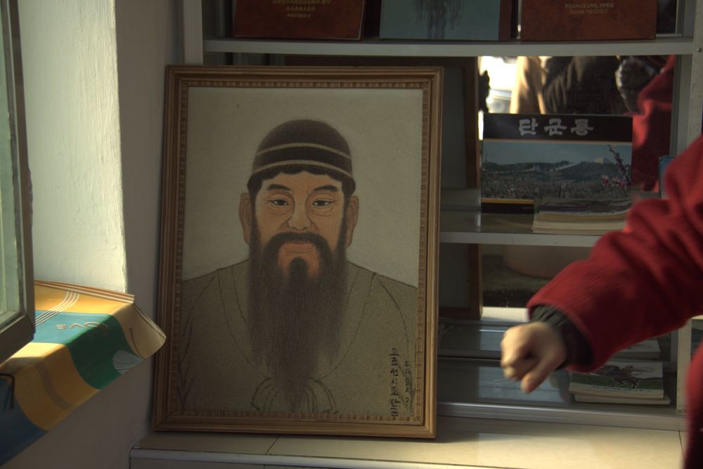 A picture of King Dangun, the mythical founder of the first unified Korean kingdom in 2333 BCE, sits at a tourist stand near what North Korea says is his tomb, just outside Pyongyang, North Korea. u00e2u20acu201d Koryo Tours handout picture via Reuters