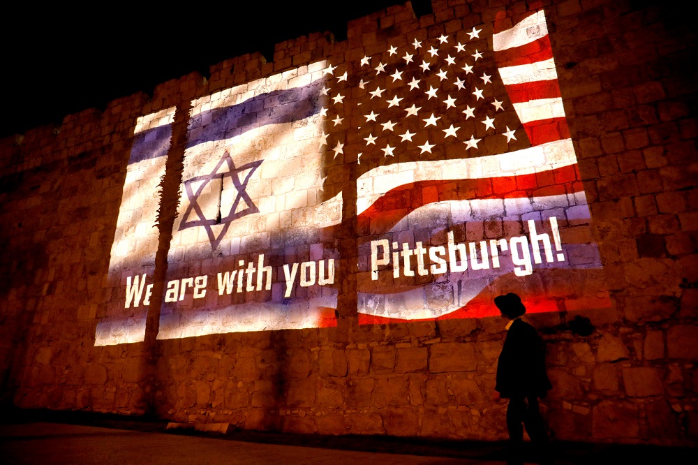 An image of Israeli and American flags with the wording, 'We are with you - Pittsburgh' is projected on the walls of Jerusalem's Old City, in solidarity with the victims of a synagogue shooting in Pittsburgh October 28, 2018. u00e2u20acu201d Reuters pic