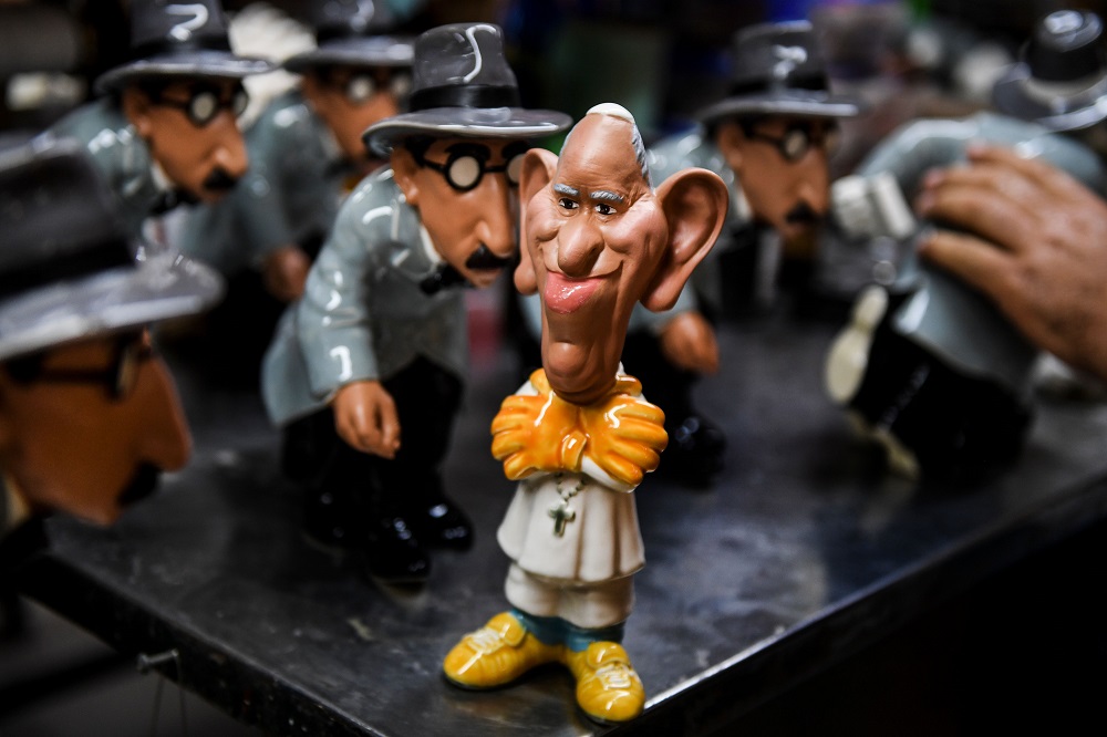 A ceramic piece depicting Pope Francis is seen beside others representing Portuguese writer Fernando Pessoa, caricatured by the designer Antonio Antunes, at Bordallo Pinheiro Factory in Caldas da Rainha on September 13, 2018. u00e2u20acu201d AFP pic   