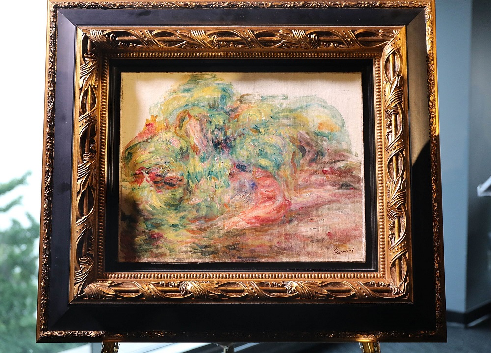 The recovered Impressionist painting u00e2u20acu02dcTwo Women in a Gardenu00e2u20acu2122, painted in 1919 by Pierre-Auguste Renoir is displayed at a news conference on September 12, 2018 in New York. u00e2u20acu201d AFP pic  