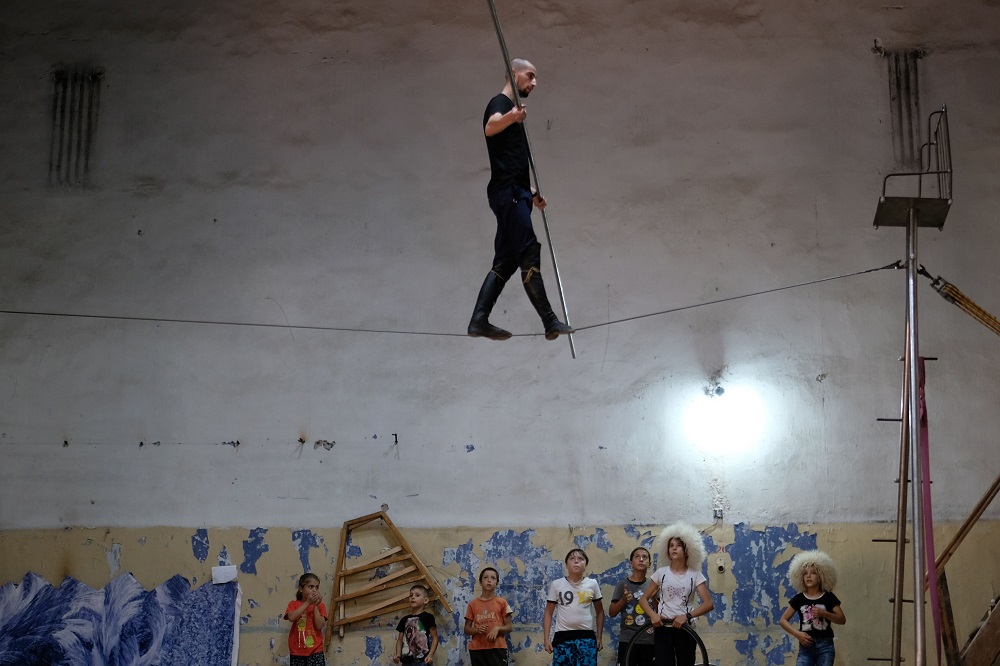 A tightrope walker practices on a wire at a local circus studio called Pekhlevan, meaning hero or fighter, led by Askhabali Gasanov in Dagestanu00e2u20acu2122s main city of Makhachkala August 23, 2018. u00e2u20acu201d AFP pic 
