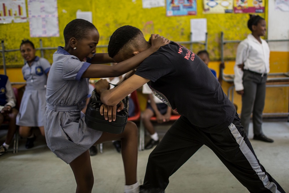 Girls practice self defence methods during a session with NGO Action Breaks Silence at Mbuyisa Makhubu Primary School in the South African township of Soweto on October 10, 2018. u00e2u20acu201d AFP pic