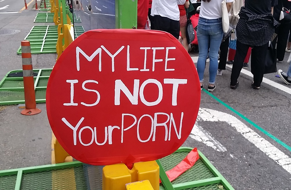This picture taken on June 9, 2018, shows a red placard reading u00e2u20acu02dcMy life is not your pornu00e2u20acu2122 during a monthly protest by South Korean women against secretly-filmed spycam pornography in Seoul. u00e2u20acu201d AFP pic 