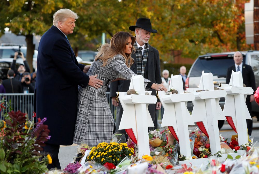 US President Donald Trump and First Lady Melania Trump place stones on a memorial to shooting victims outside the synagogue where a gunman killed eleven people and wounded six during a mass shooting in Pittsburgh, October 30, 2018. u00e2u20acu201d Reuters pic