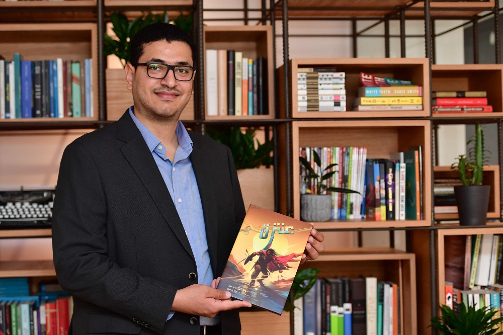 Comic artist Mumen Hilmi poses in his office with his illustrated comic book u00e2u20acu02dcAntarau00e2u20acu2122 in the Gulf emirate of Sharjah September 18, 2018. u00e2u20acu201d AFP pic  
