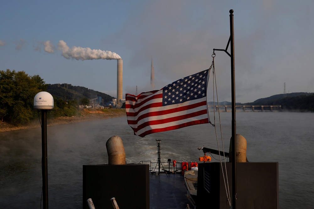 The US flag flies on Campbell Transportationu00e2u20acu2122s towboat M.K. McNally as it passes the W. H. Sammis Power Plant, a coal-fired power-plant owned by FirstEnergy, along the Ohio River in Stratton, Ohio September 10, 2017. u00e2u20acu201d Reuters pic