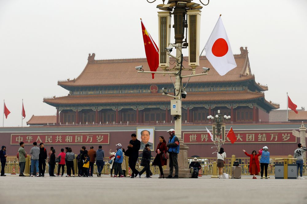 People visit the Tiananmen Square decorated with Chinese and Japanese flags ahead of Japanu00e2u20acu2122s Prime Minister Shinzo Abeu00e2u20acu2122s visit, in Beijing, China October 25, 2018. u00e2u20acu2022 Reuters pic
