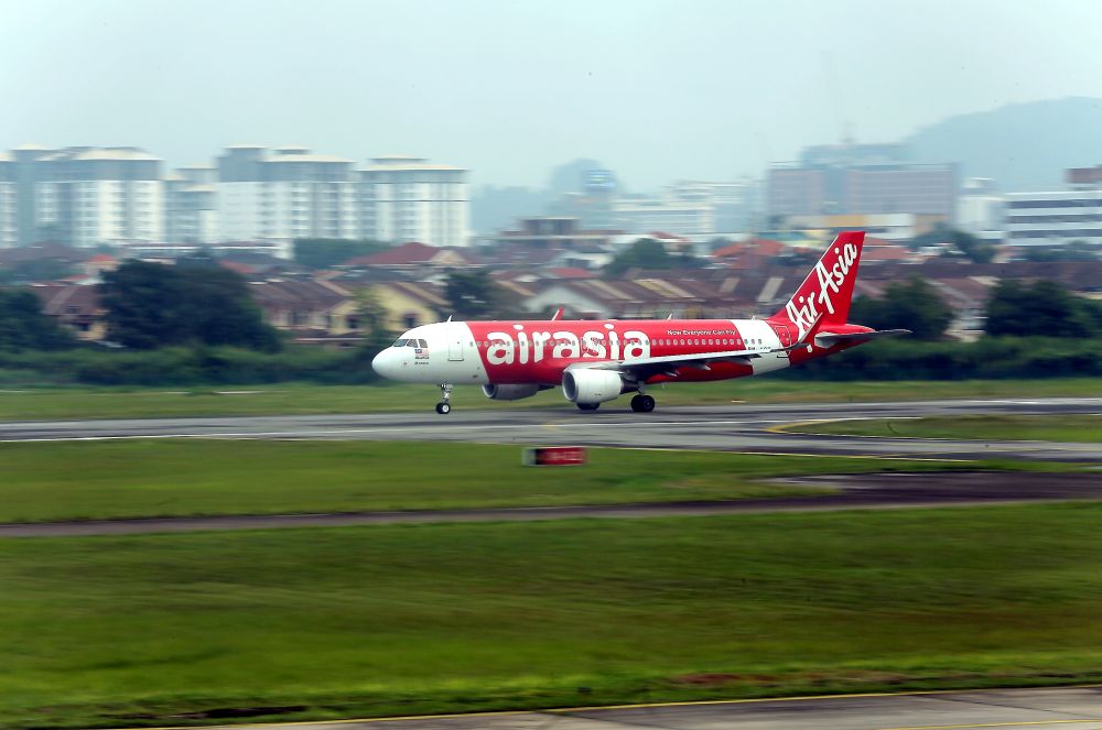 An AirAsia plane lands on the tarmac at the Sultan Azlan Shah airport in Ipoh October 1, 2018. u00e2u20acu201d Picture by Farhan Najib