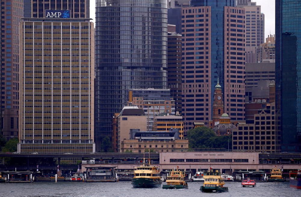 The head office building of AMP Ltd, Australia's biggest retail wealth manager, is seen behind ferries docking at Sydney's Circular Quay October 28, 2016. u00e2u20acu201d Reuters pic