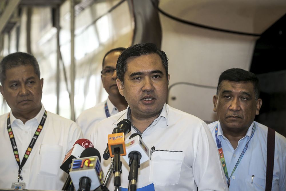 Transport Minister Anthony Loke (centre) speaks to reporters at the Tun Sambanthan monorail station in Kuala Lumpur October 9, 2018. u00e2u20acu2022 Picture by Hari Anggara