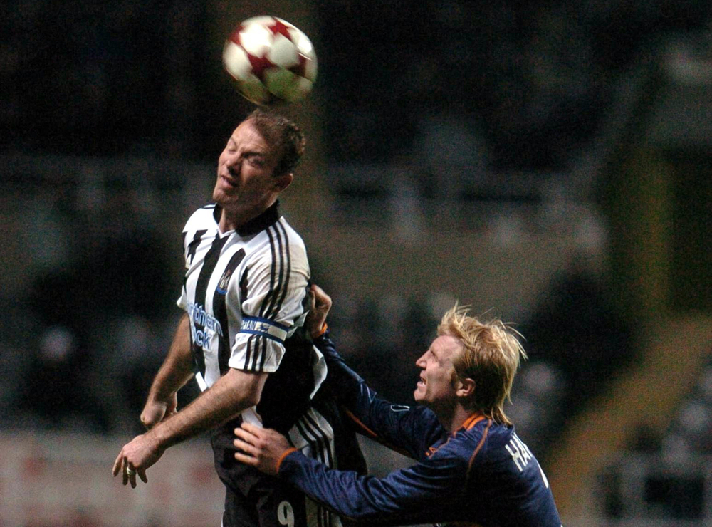 Newcastle's Alan Shearer (left) and SC Heerenveen's Petter Hansson jump for the ball during their Uefa Cup football match. u00e2u20acu201d AFP pic