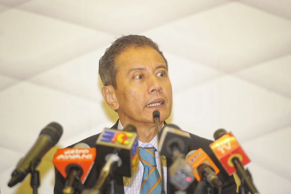 EC chairman Azhar Azizan Harun speaks during a press conference in Putrajaya October 31,2018. u00e2u20acu2022 Picture by Shafwan Zaidon