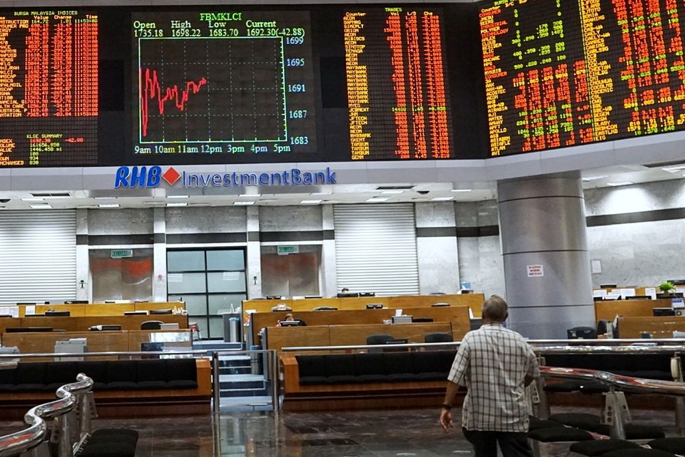 An investor monitors share market prices in Kuala Lumpur October 11, 2018. u00e2u20acu201d Picture by Ahmad Zamzahuri