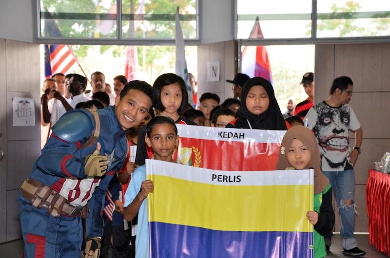 The flag parade during the Science Carnival last year. u00e2u20acu201d Picture courtesy of Care United