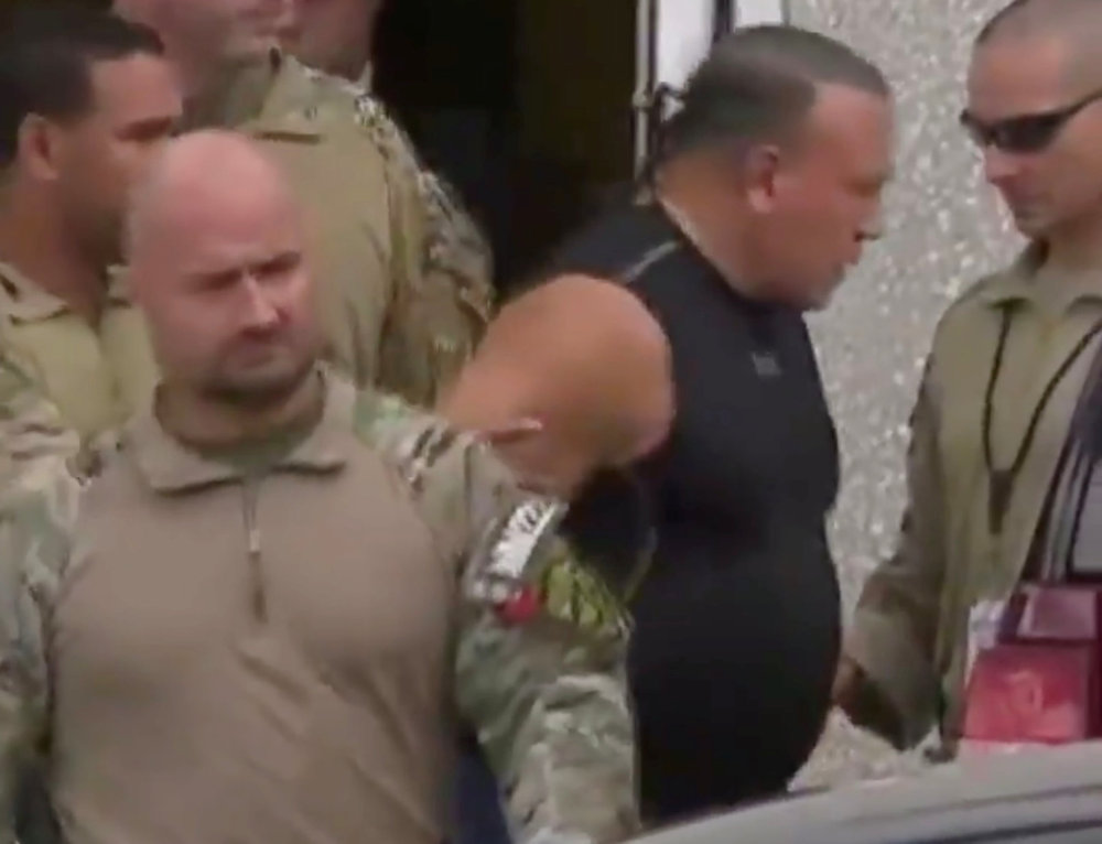 Cesar Altieri Sayoc (second right), who was arrested during an investigation into a series of parcel bombs, is escorted from an FBI facility in Miramar, Florida October 26, 2018 in a still image from video. u00e2u20acu201d Reuters pic