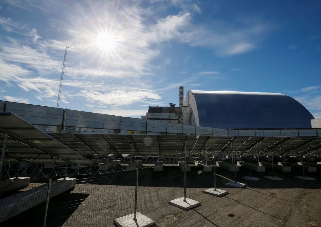 Solar panels are seen through barbed wire in front of the New Safe Confinement arch covering the damaged fourth reactor of the Chernobyl nuclear power plant, at a newly built solar power plant in Chernobyl October 5, 2018. u00e2u20acu201d Reuters pic