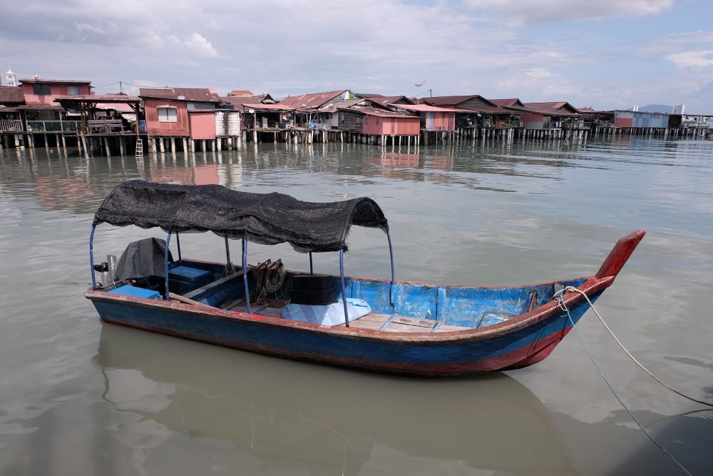 The wooden village houses on stilts were built along the wooden piers that jutted out into the sea and many families continue to live there till today. u00e2u20acu2022 Picture by KE Ooi