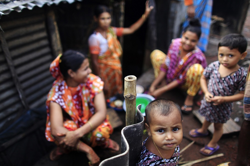 Children play in front of a makeshift house next to a railway track in Dhaka August 27, 2012. u00e2u20acu201d Reuters pic 