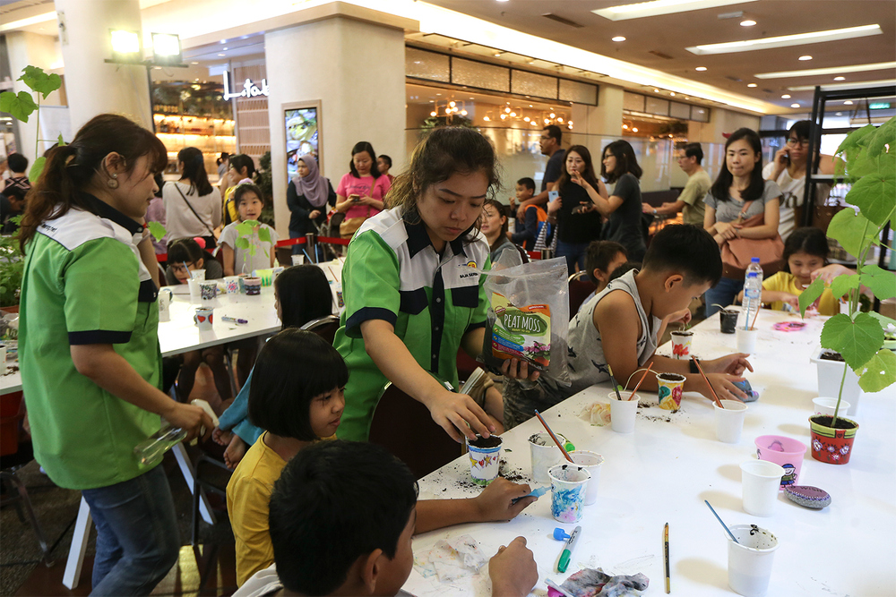 Kids learn how to paint and tend to a potted plant in a session by Serbajadi Gardening. u00e2u20acu201c Pictures by Azneal Ishak