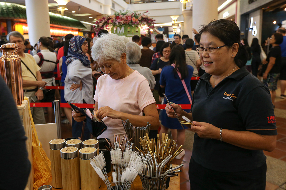Shoppers check out the eco-friendly products at The Hive stall.