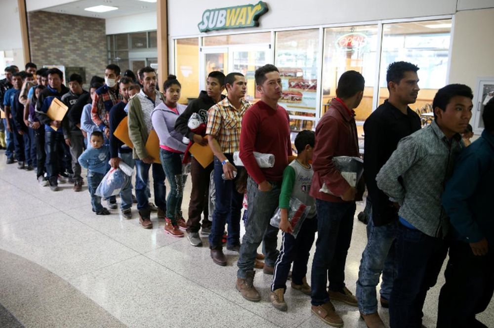 Undocumented immigrants just released from detention through u00e2u20acu02dccatch and releaseu00e2u20acu2122 immigration policy stand at a bus station before being taken to the Catholic Charities relief centre in McAllen, Texas, US, April 11, 2018. u00e2u20acu201d Reuters pic