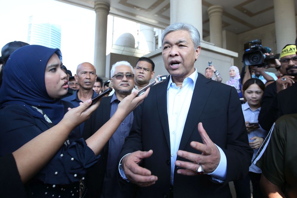 Datuk Seri Ahmad Zahid Hamidi speaks to reporters outside the Kuala Lumpur High Court October 25, 2018. u00e2u20acu201d Picture by Azinuddin Ghazali