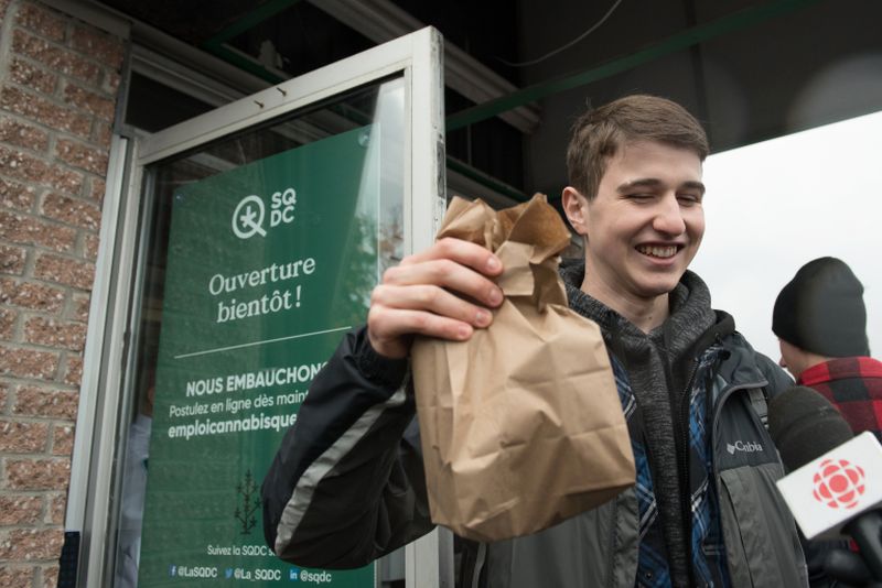 A man holds a bag of marijuana he purchased in a cannabis store in Quebec City, Quebec, on October 17, 2018. u00e2u20acu2022 AFP pic