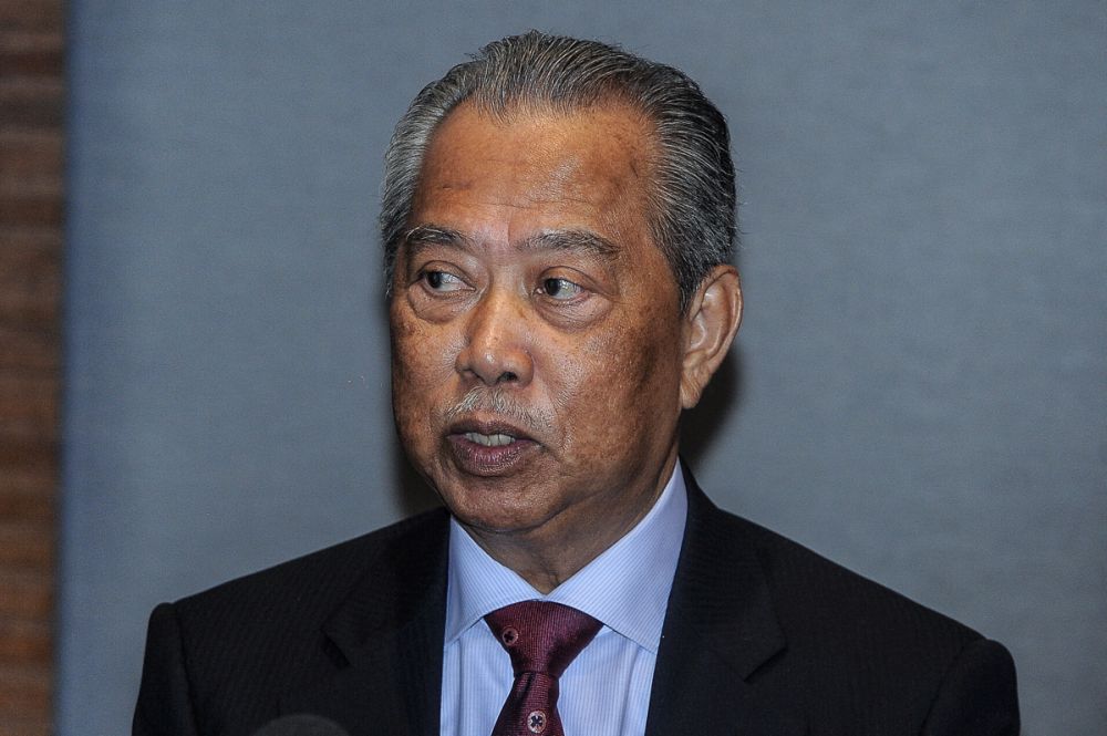 Tan Sri Muhyiddin Yassin speaks at the National Registration Department in Putrajaya October 25, 2018. u00e2u20acu201d Picture by Shafwan Zaidon