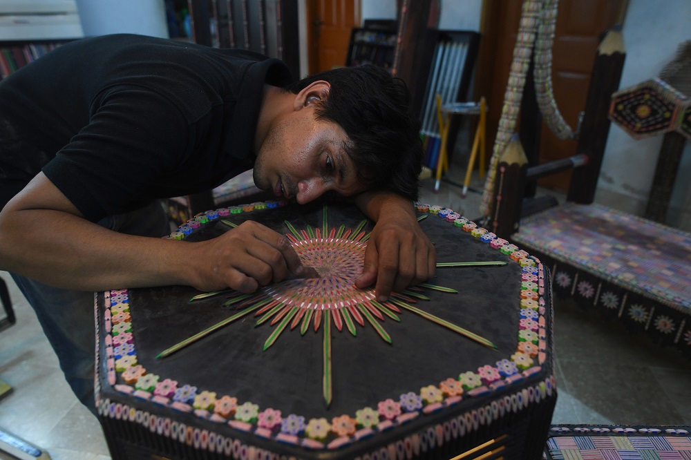 Pakistani artist Bilal Asif working in his studio in Karachi. u00e2u20acu201d AFP pic